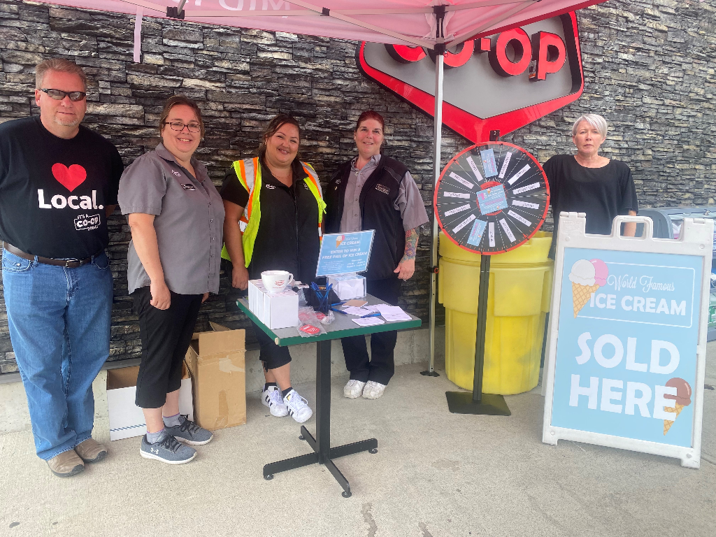 Co-op staff handing out swag