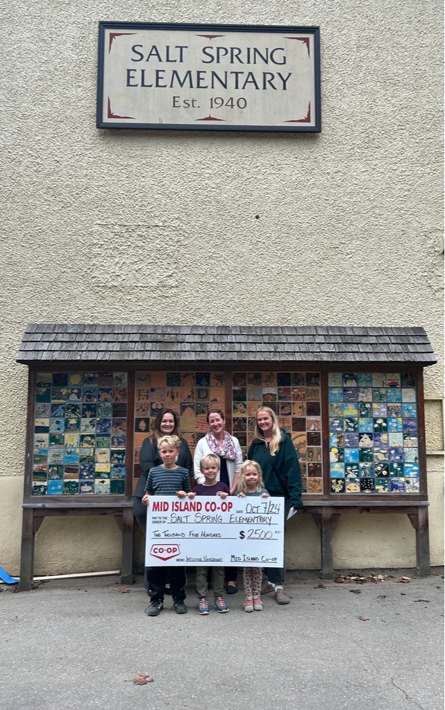 Salt Spring Elementary School PAC members accept a donation cheque from Mid Island Co-op